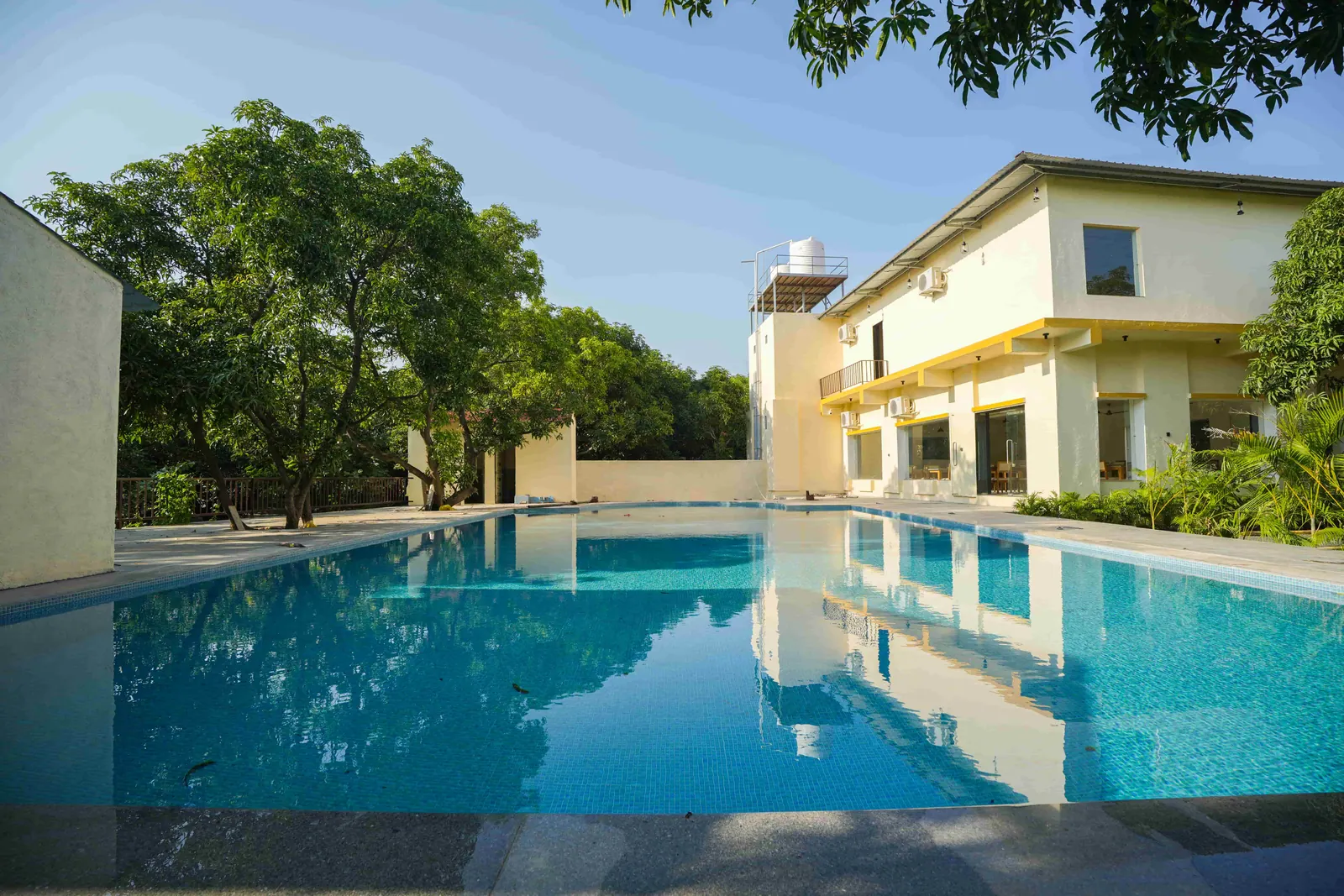 Outdoor pool and building at The Premier Girtara Resort